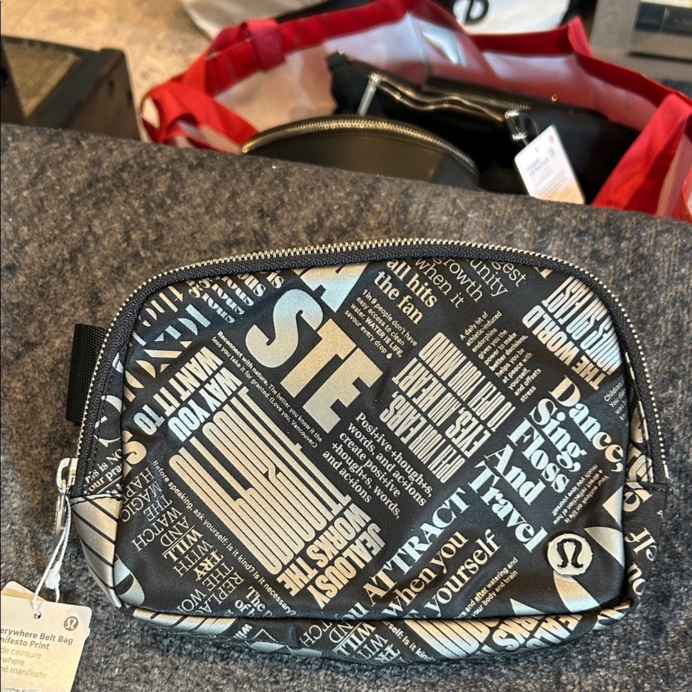 Lululemon manifesto print black/ silver belt bag. Silver hardware . NWT